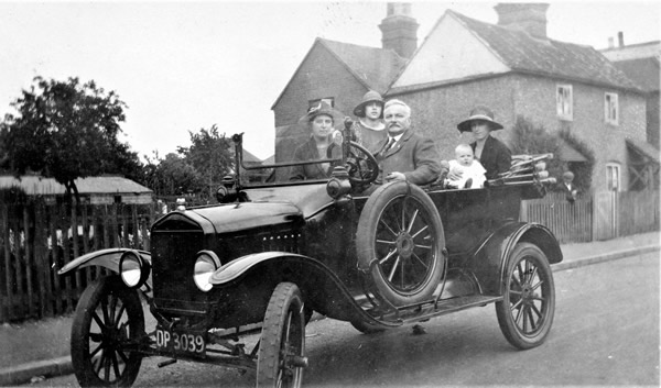 A family sat in a motor car c1924